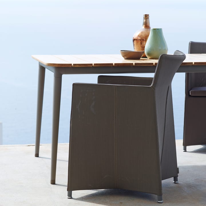 Tavolo da pranzo Core in teak 274x100x74 cm, Cavalletto grigio lava Cane-line