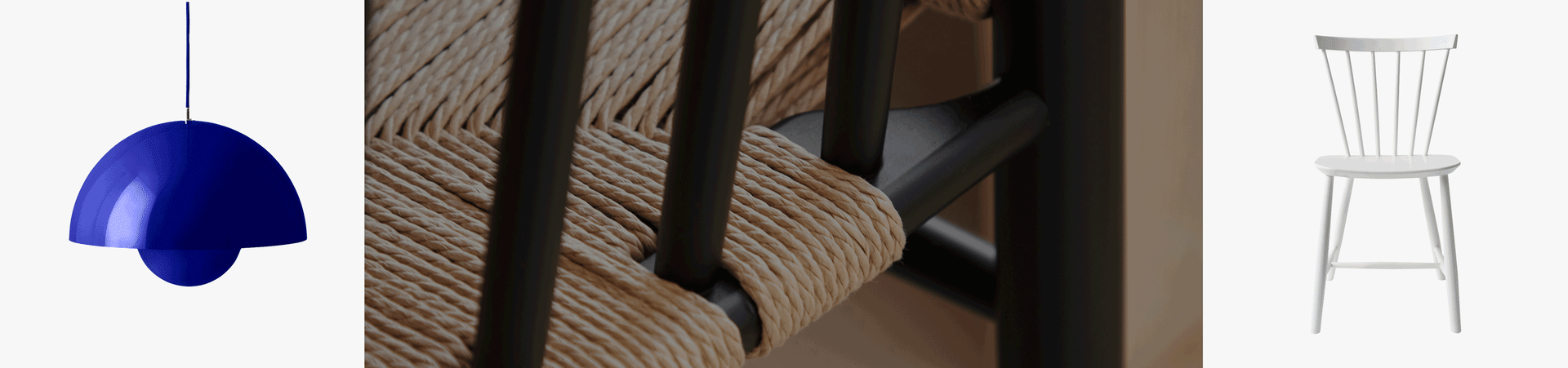 Lampada a sospensione blu, primo piano sedia con seduta in fibra naturale intrecciata, e sedia bianca in legno a fusi.